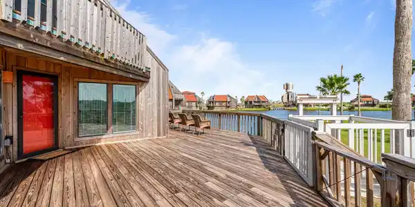 Image 3: Expansive covered downstairs patio and two large d