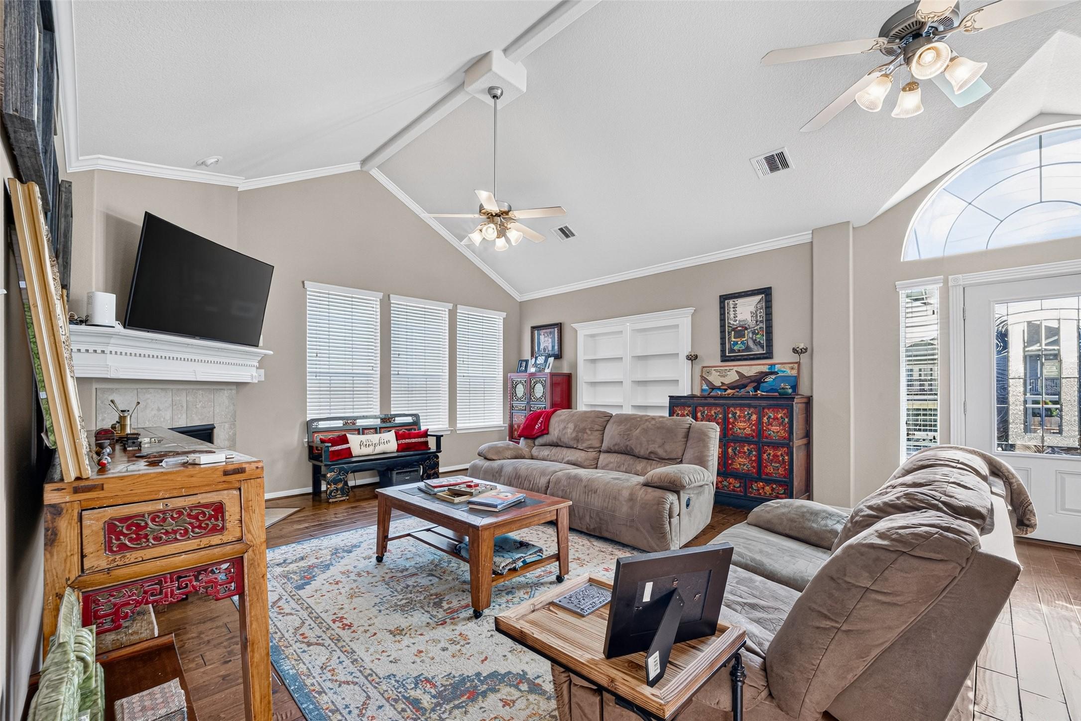 Image 4: Light filled living room with high ceilings.