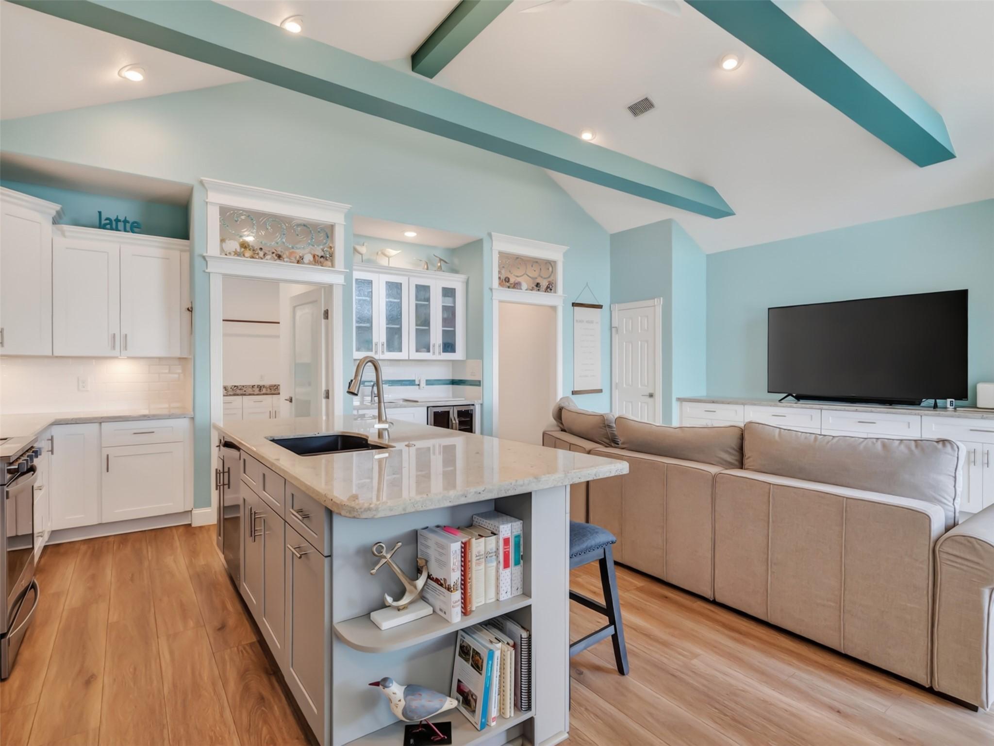 Image 4: The living area includes space for a cozy sectiona