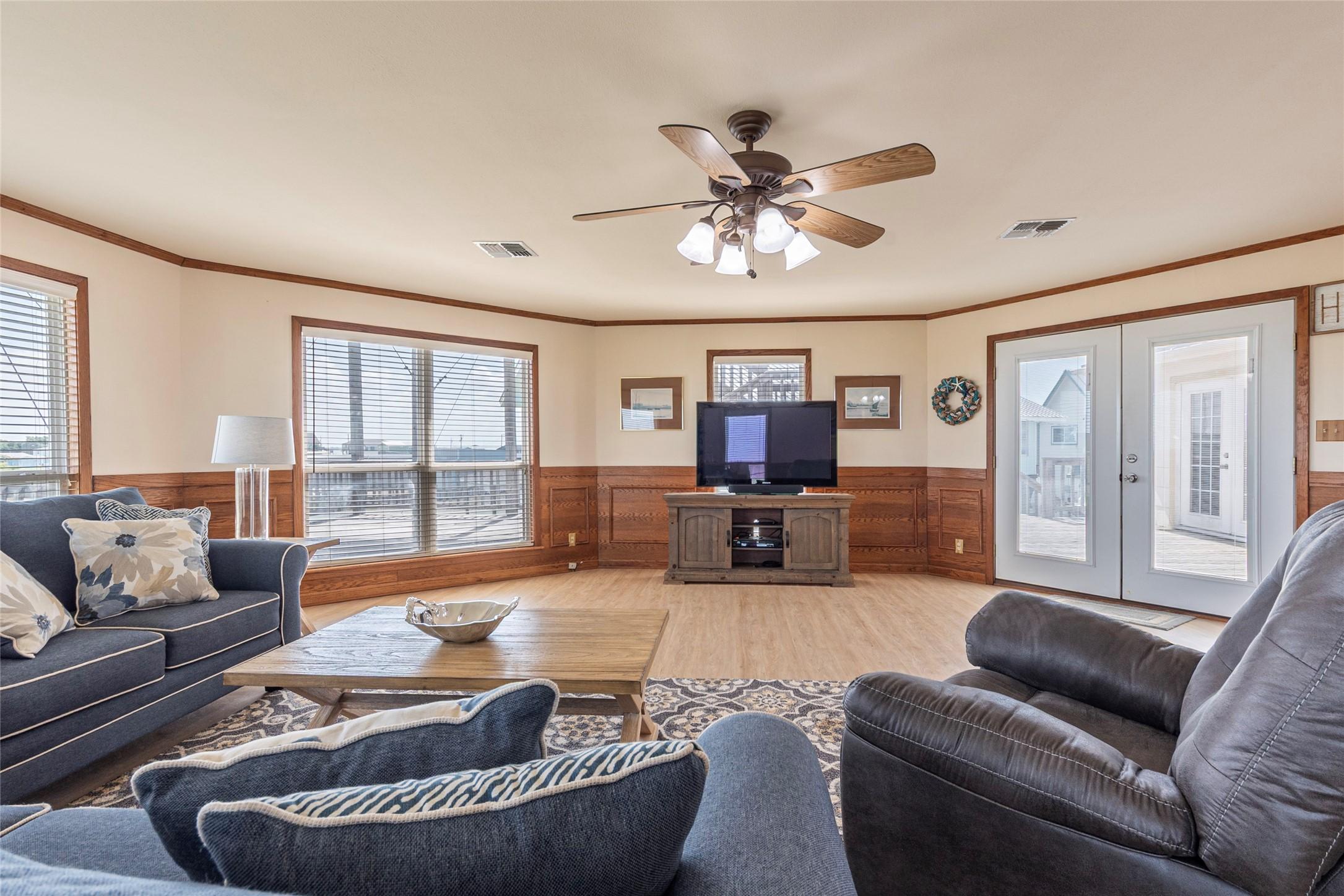 Image 4: This living room is spacious and bright, featuring