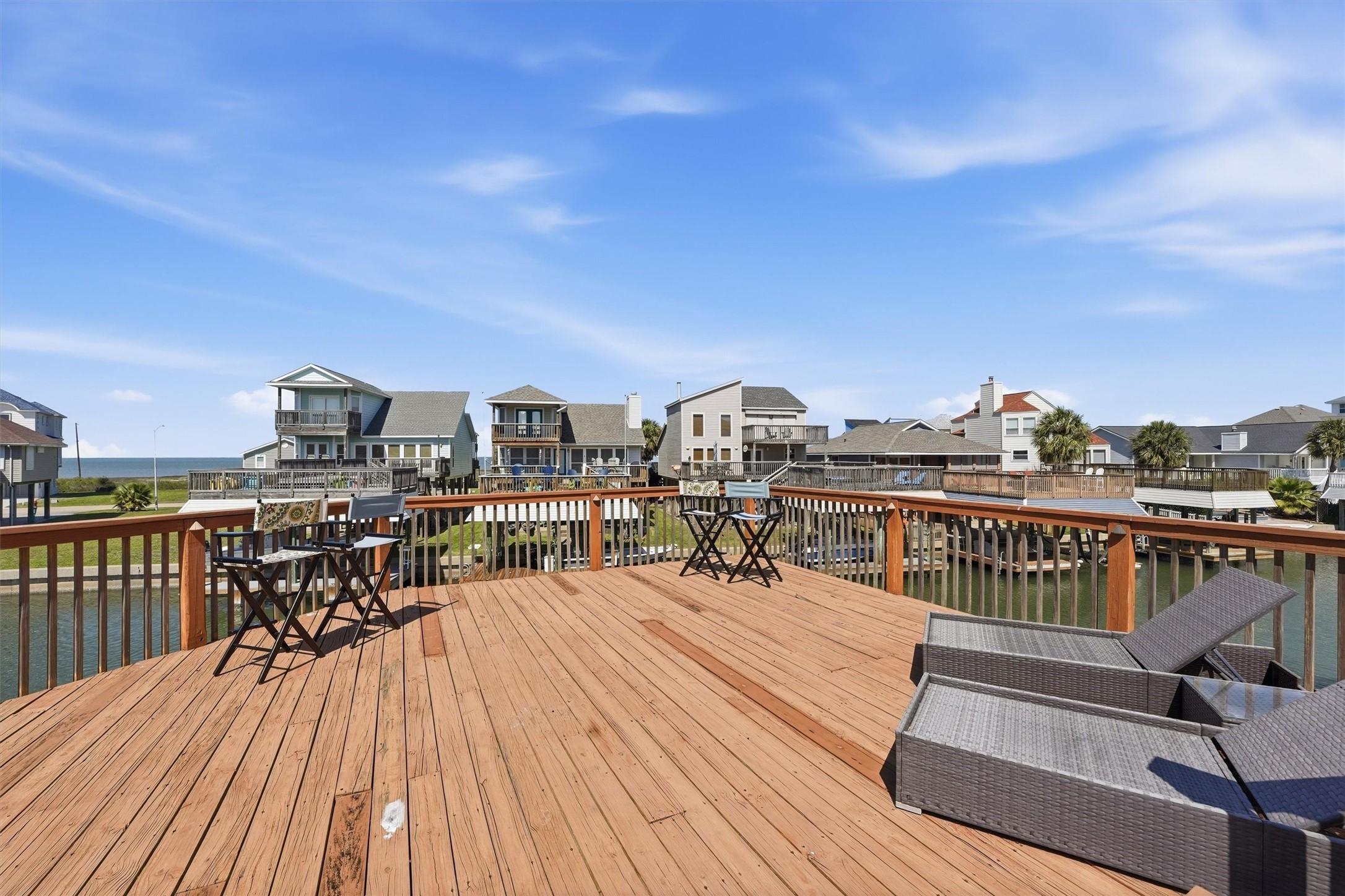 Image 4: Spacious waterfront deck offering the perfect sett