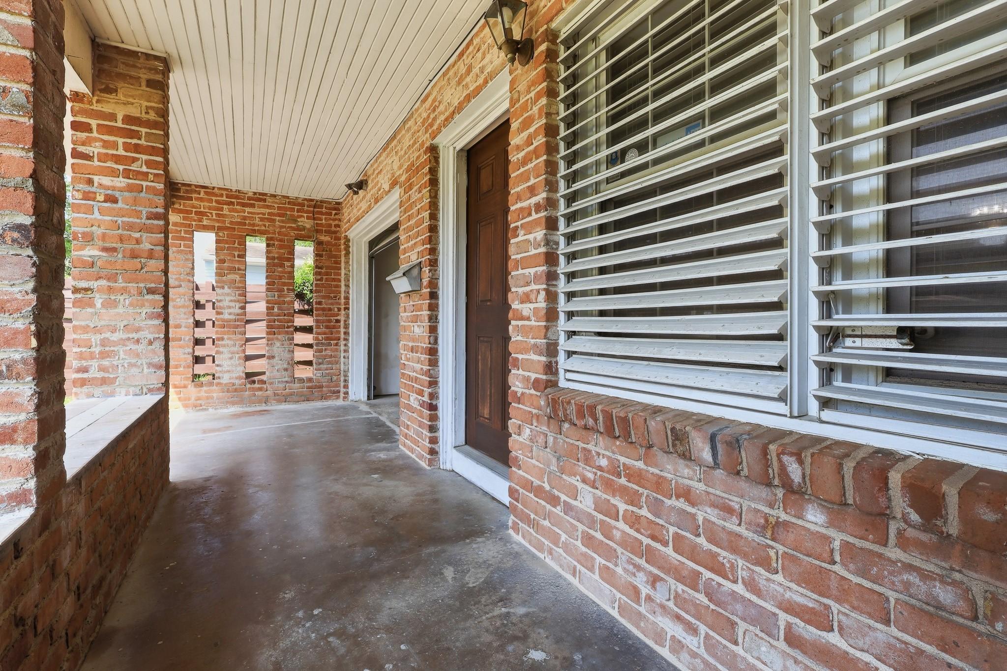 Image 4: Covered front porch with brick detailing, perfect