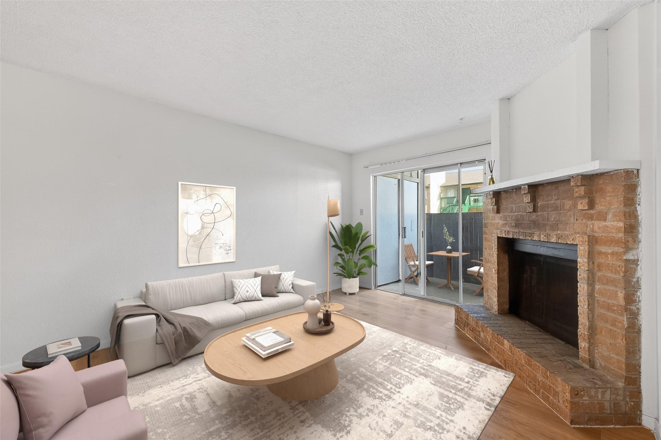 Image 1: This bright room features laminate floors, a cozy