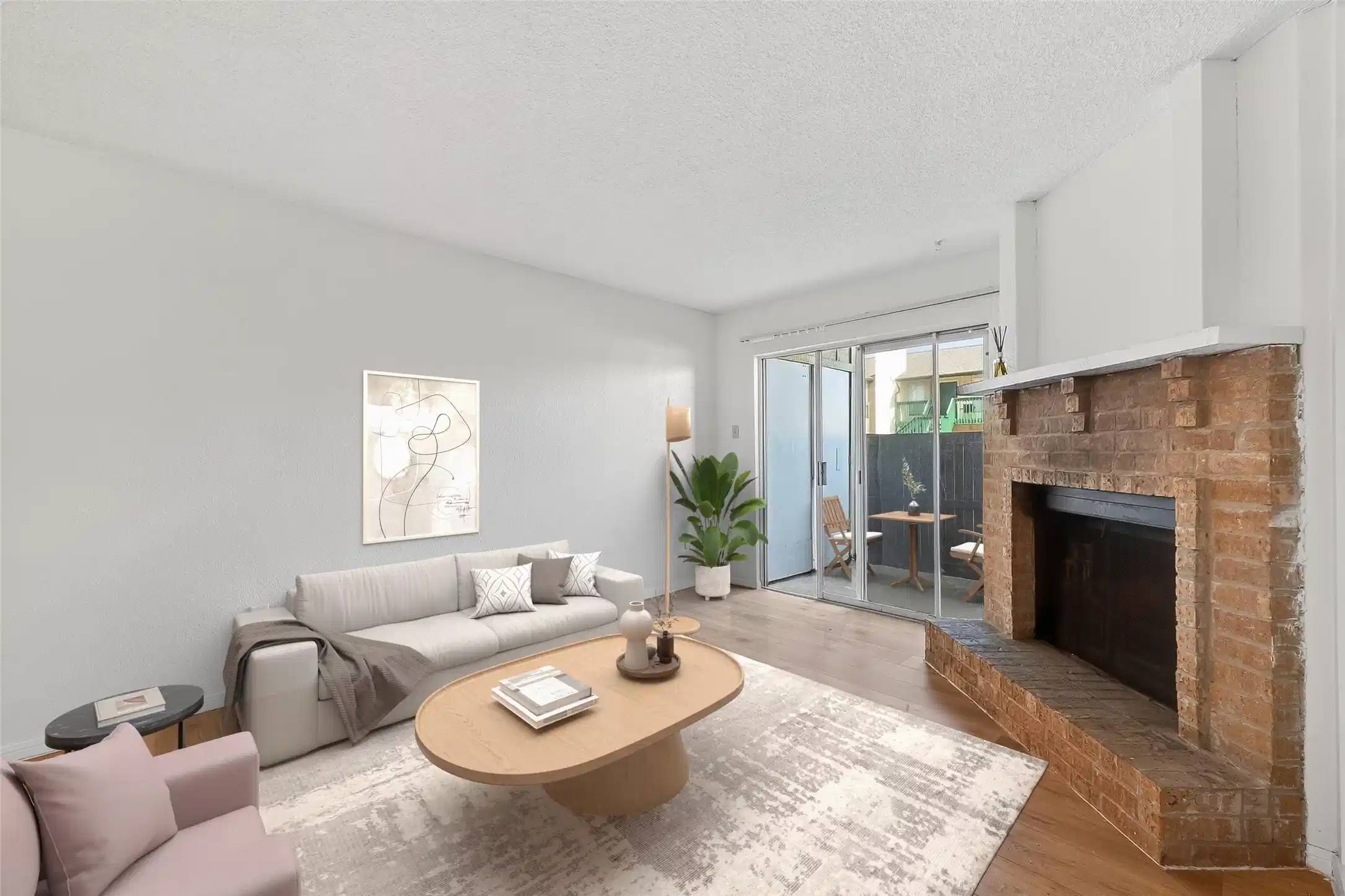 Image 1: This bright room features laminate floors, a cozy