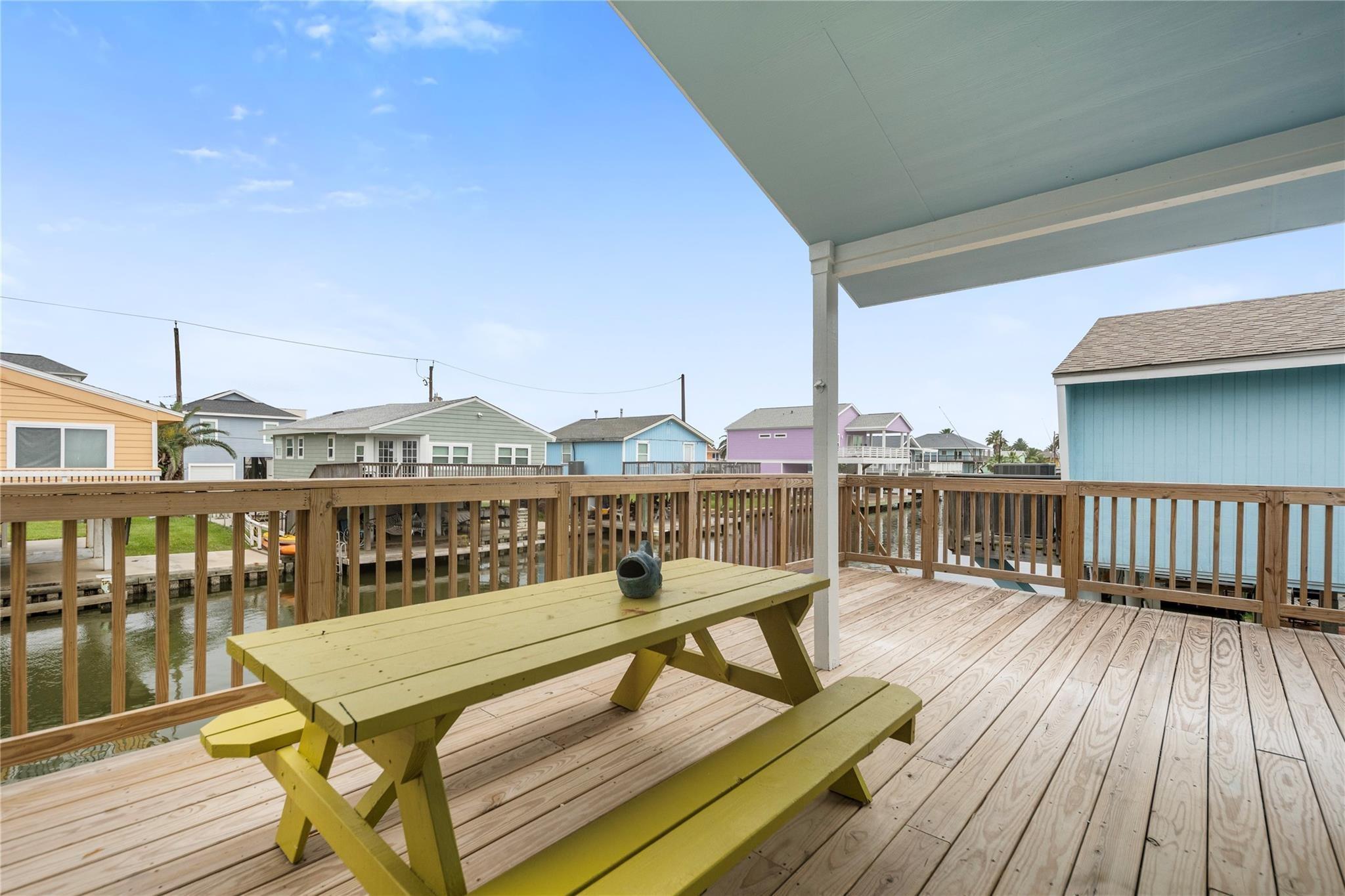 Image 2: An inviting coastal-style home elevated on stilts