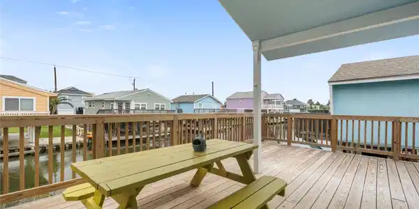 Image 2: An inviting coastal-style home elevated on stilts