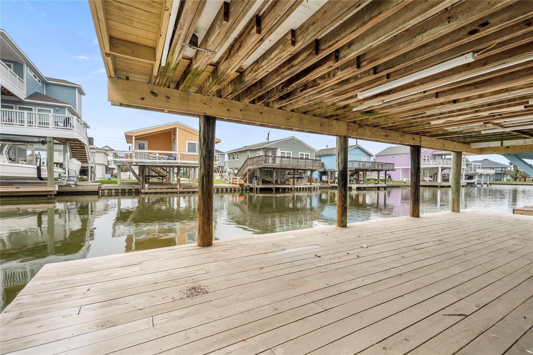 Image 4: An inviting coastal-style home elevated on stilts