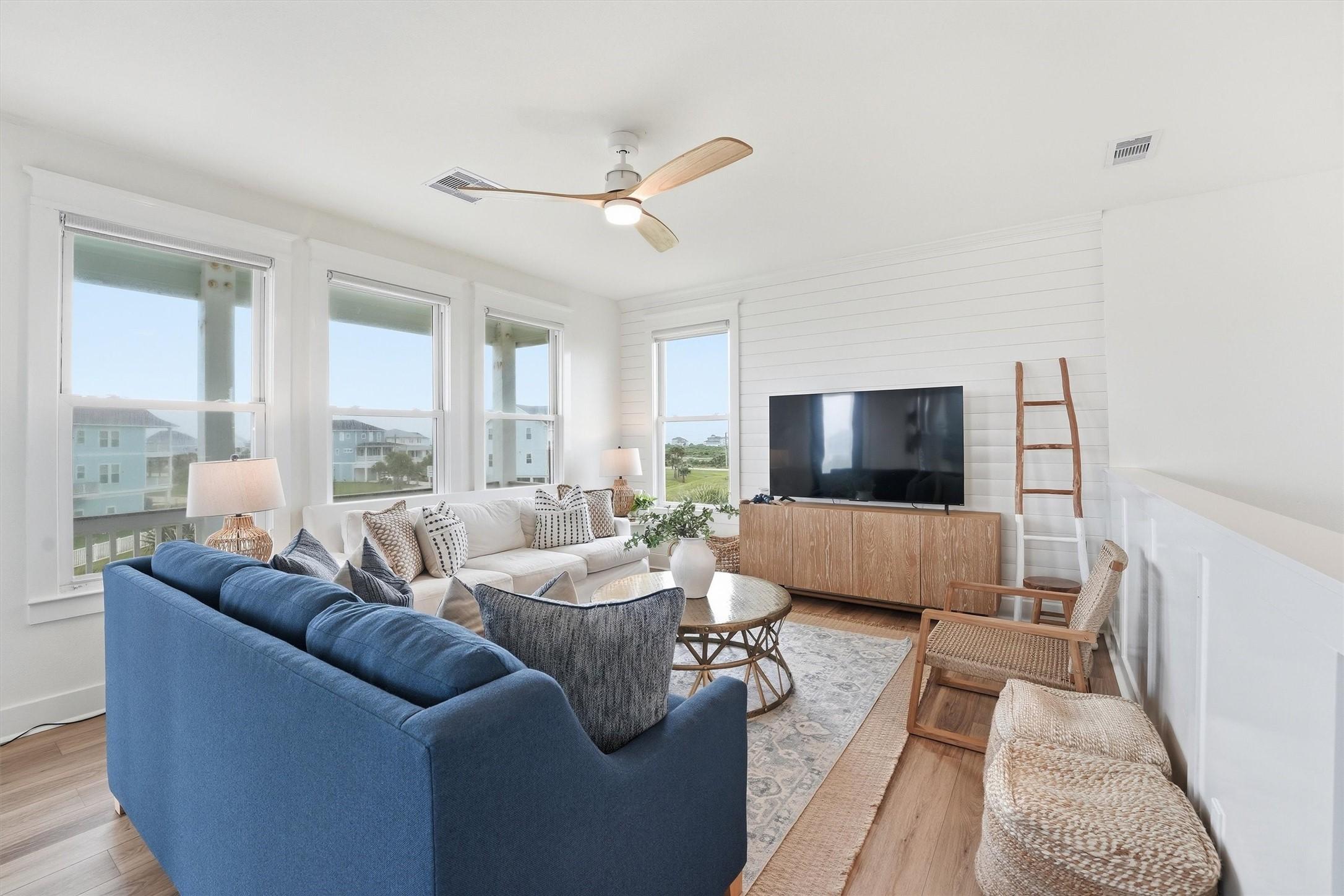 Image 2: Light filled living area with scenic views, coasta
