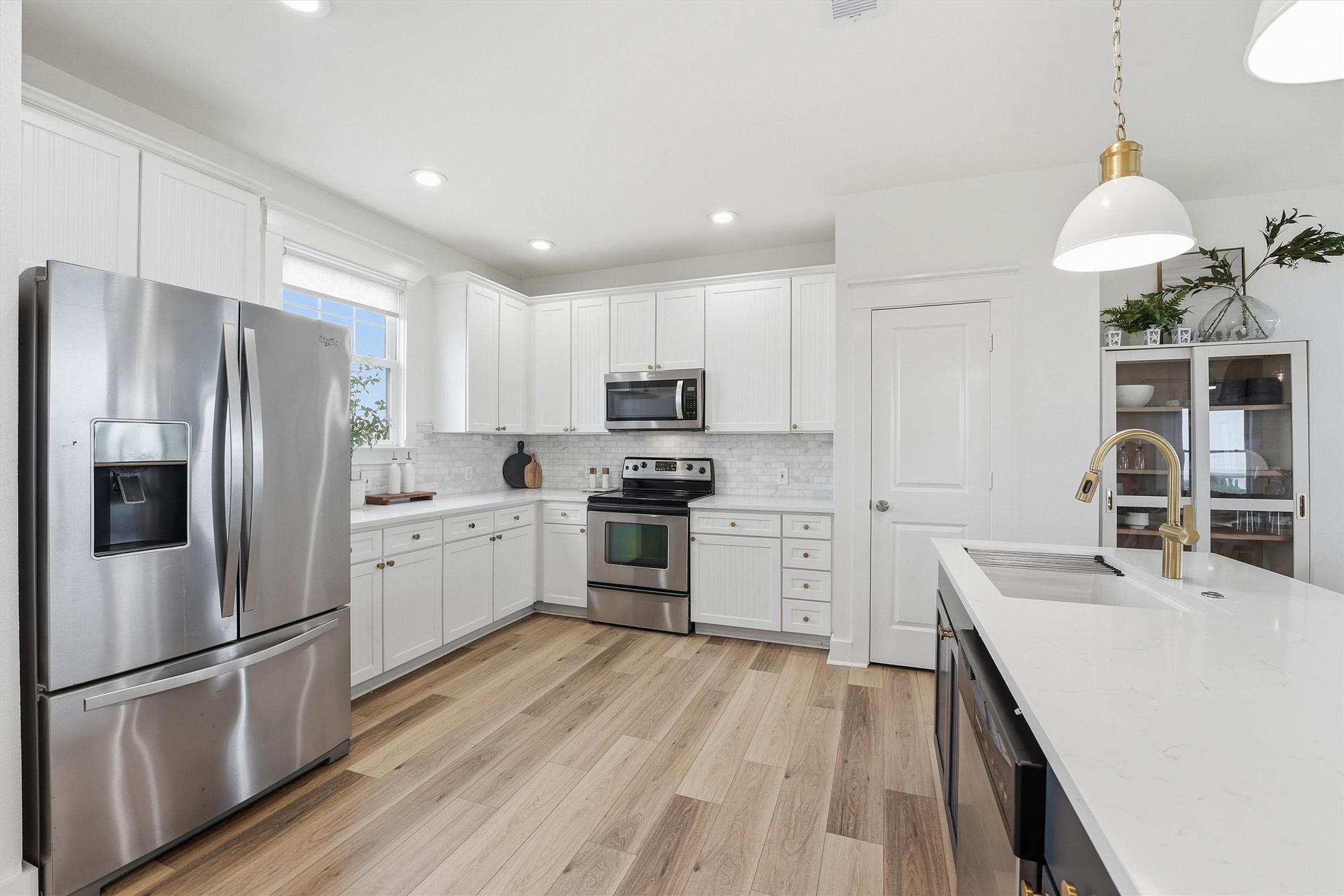 Image 4: Updated kitchen with stainless steel appliances, w