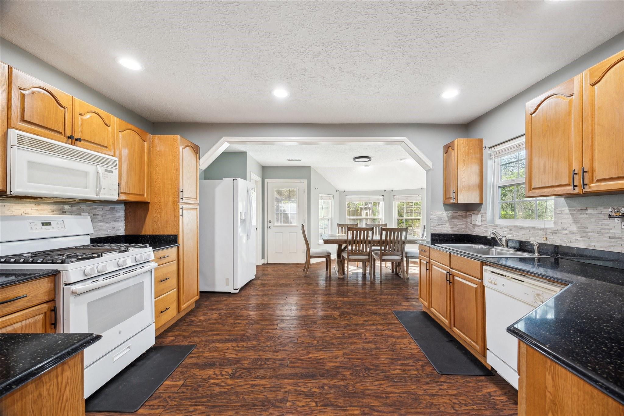 Image 4: Enjoy views of the dining room from the kitchen&mdash;pe