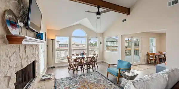 Image 3: Bright and inviting family room with vaulted ceili