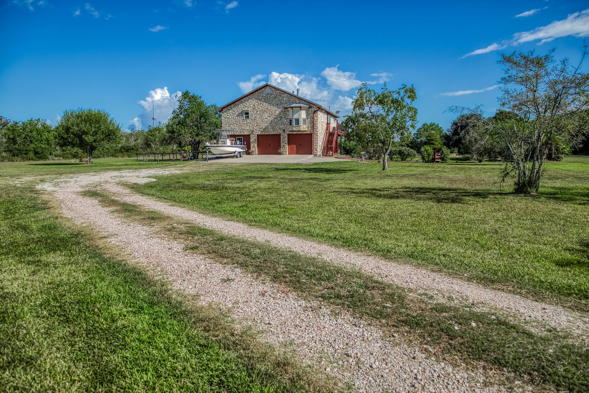 Image 3: Set on 5 expansive acres, this property features a
