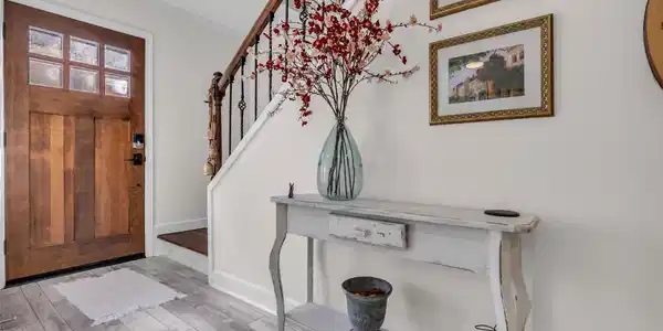 Image 2: The foyer provides a welcoming first impression, w