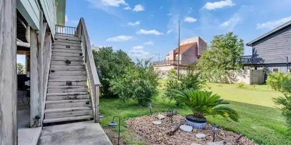 Image 4: Beautiful landscaping surrounding house