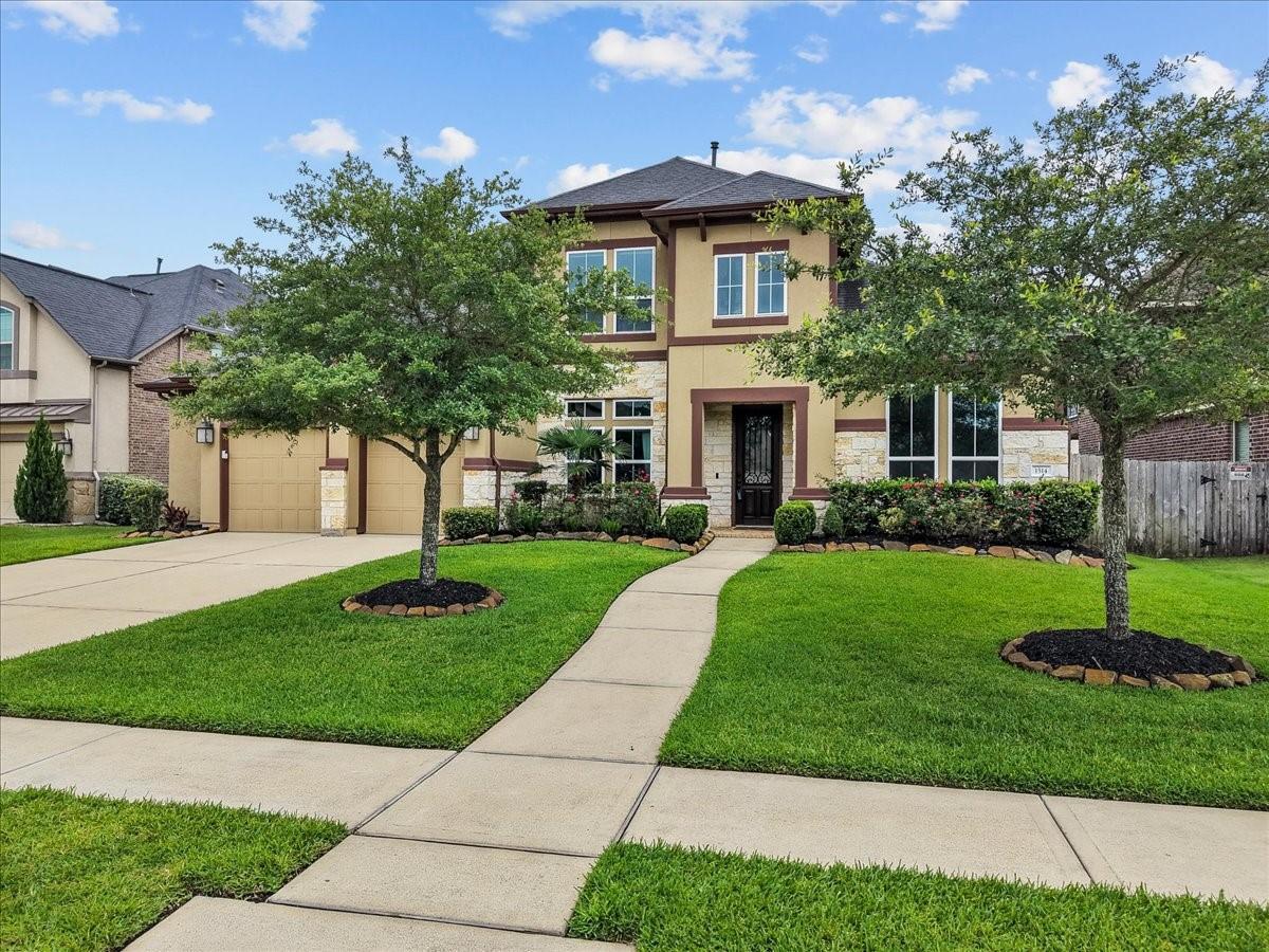 Image 2: Immaculately maintained two-story home nestled on