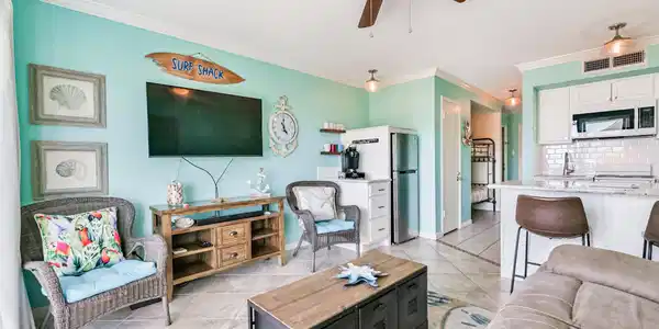 Image 3: Comfortable main living space with breakfast bar a
