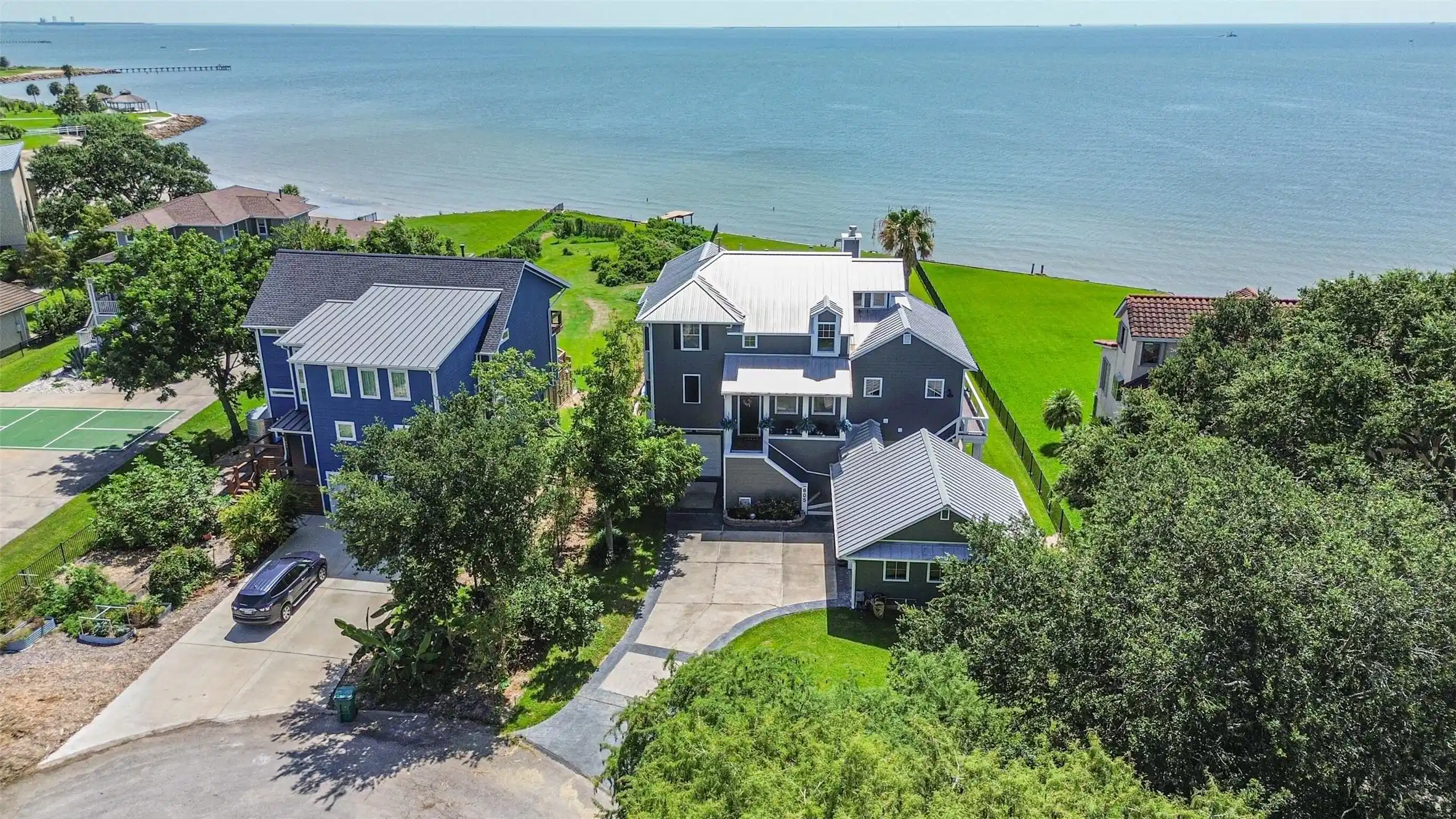 Image 1: Stunning coastal home with direct ocean views, fea