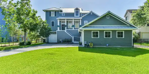 Image 2: A beautiful two-story home with a welcoming front