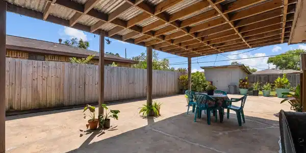 Image 3: Imagine spending evenings out here! The covered pa
