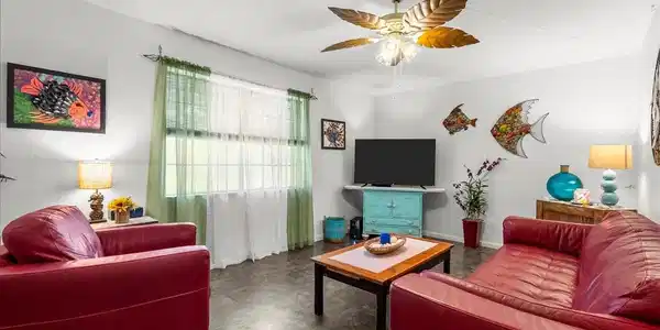 Image 4: Step inside to a bright, open living and dining ar