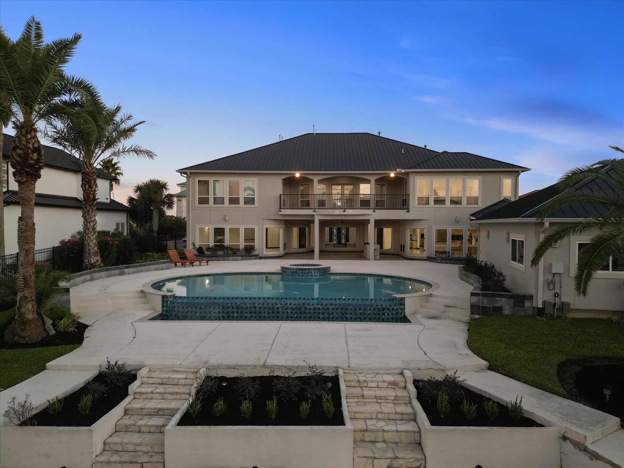 Image 3: Backyard oasis with pool and hot tub