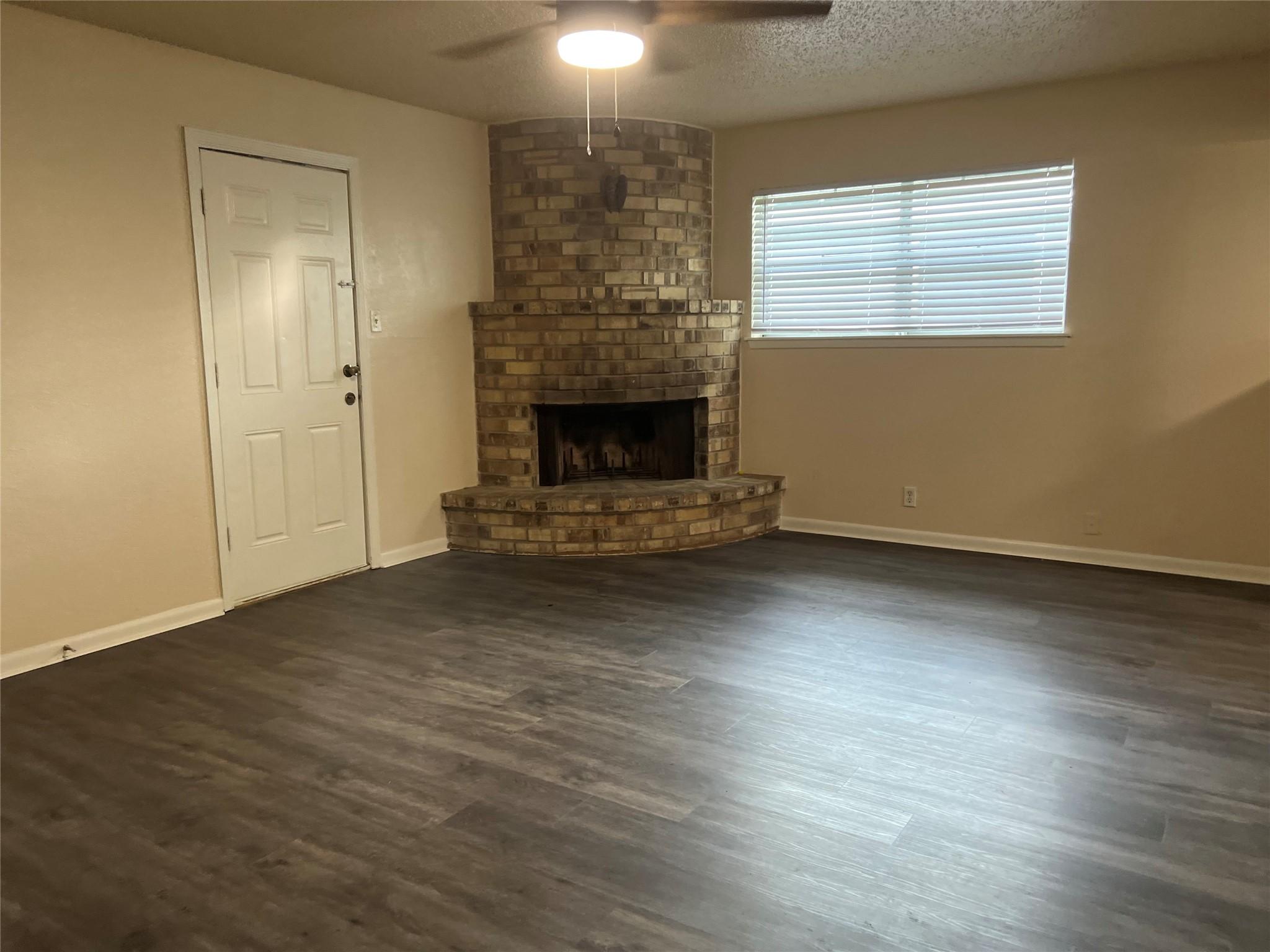 Image 2: Corner-set fireplace adds warmth and character to