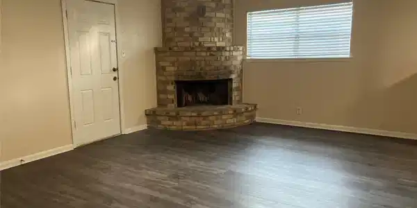 Image 2: Corner-set fireplace adds warmth and character to