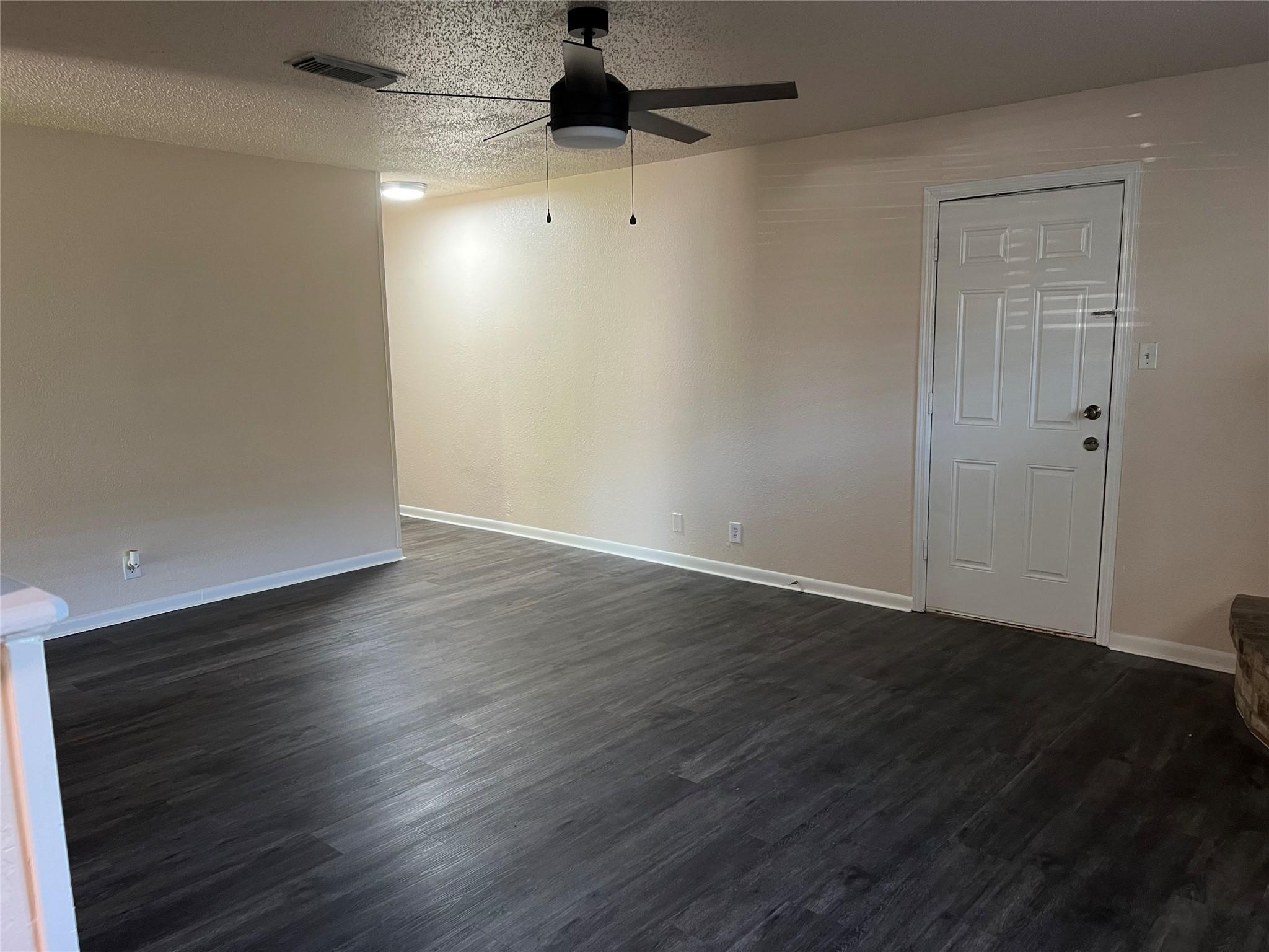 Image 3: Living room with new waterproof vinyl tile floorin