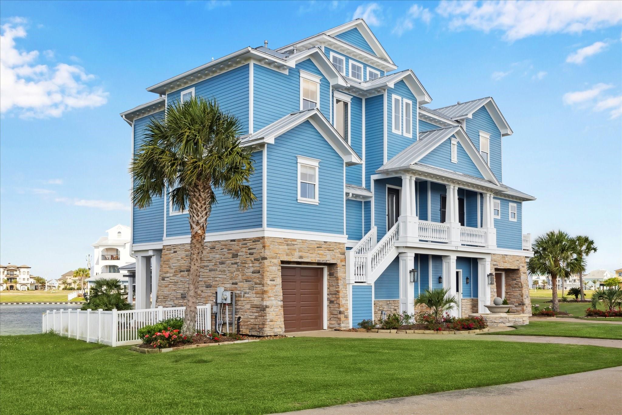Image 4: This stunning coastal home features classic blue H