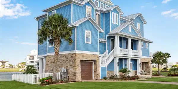 Image 4: This stunning coastal home features classic blue H