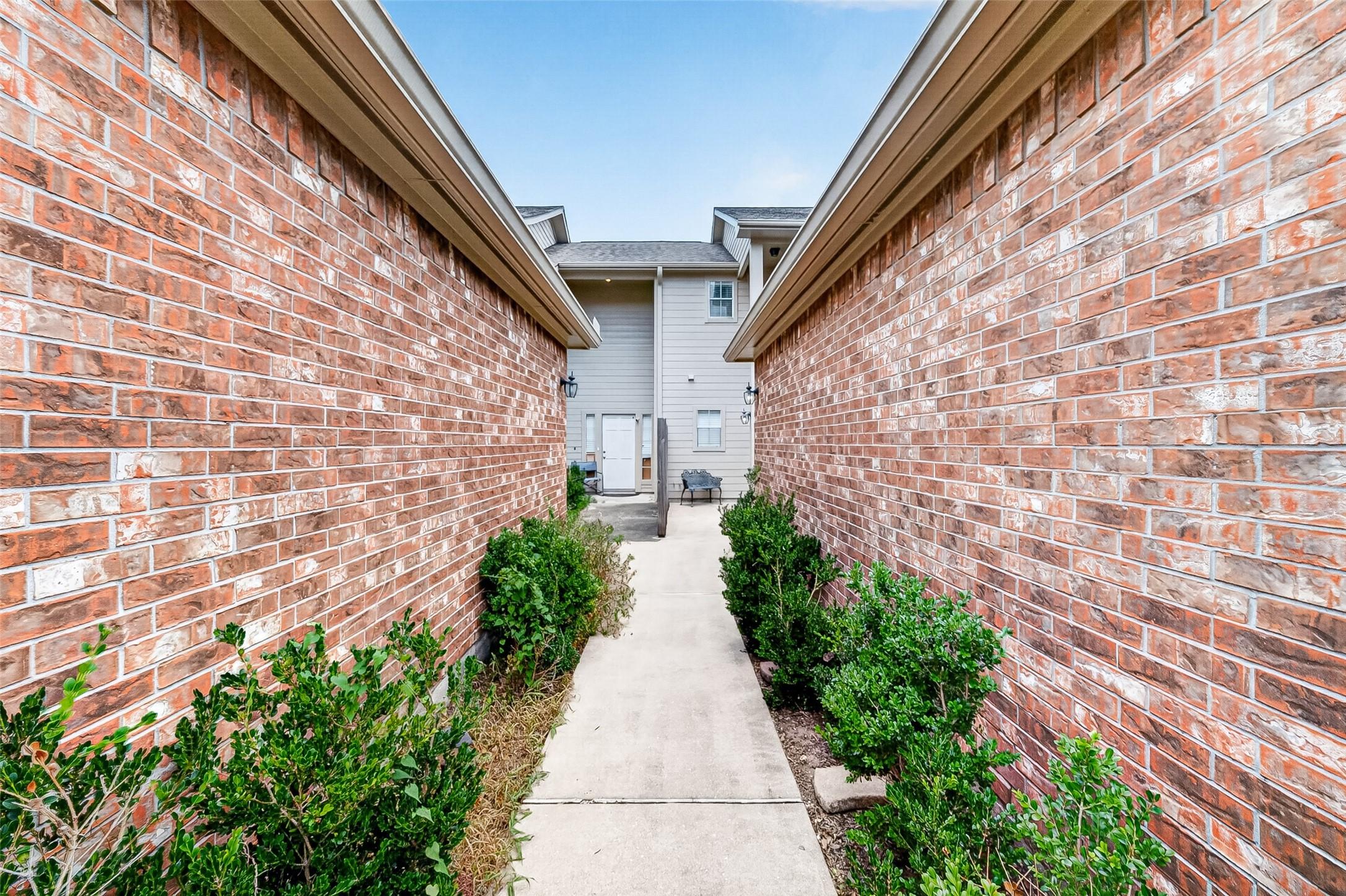 Image 4: Private, landscaped walkway leads to a secluded co