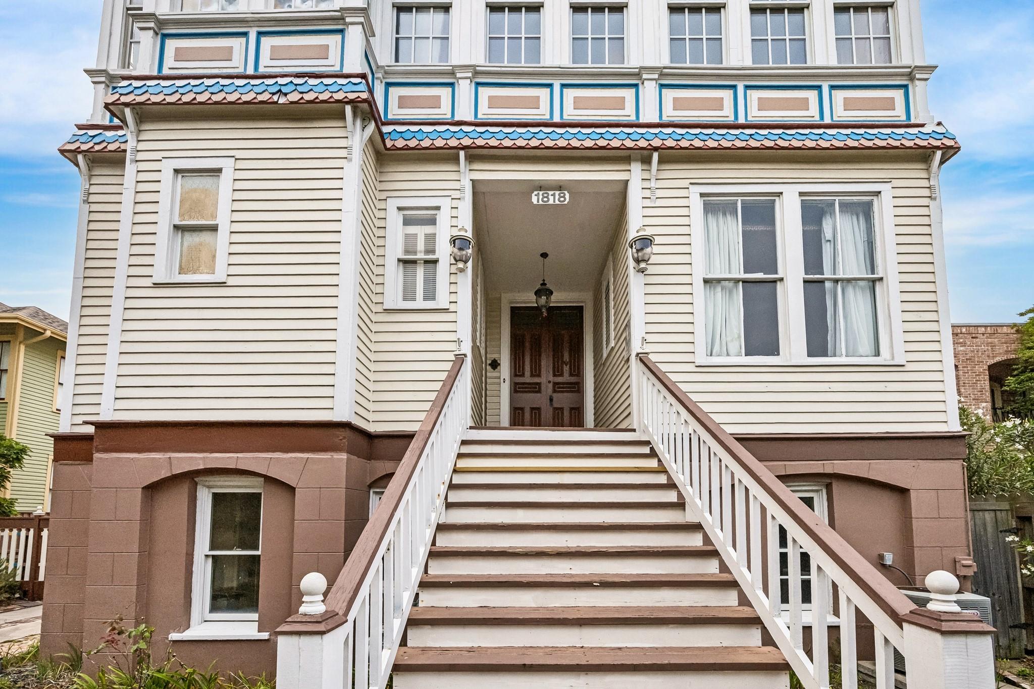 Image 3: Grand staircase leading you the front entry