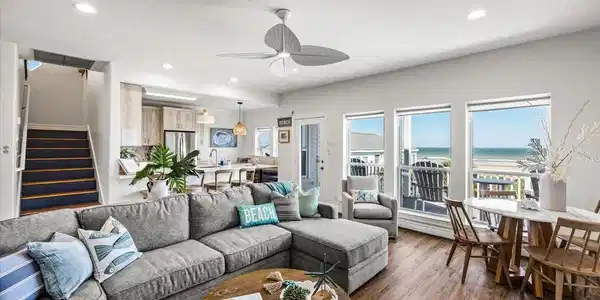 Image 4: This bright and airy living space features ocean v
