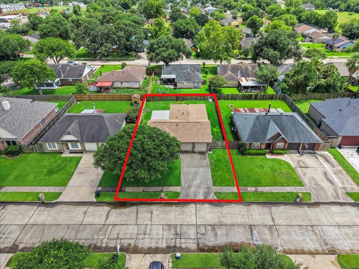 Image 3: Aerial view showing the home's lot boundaries and