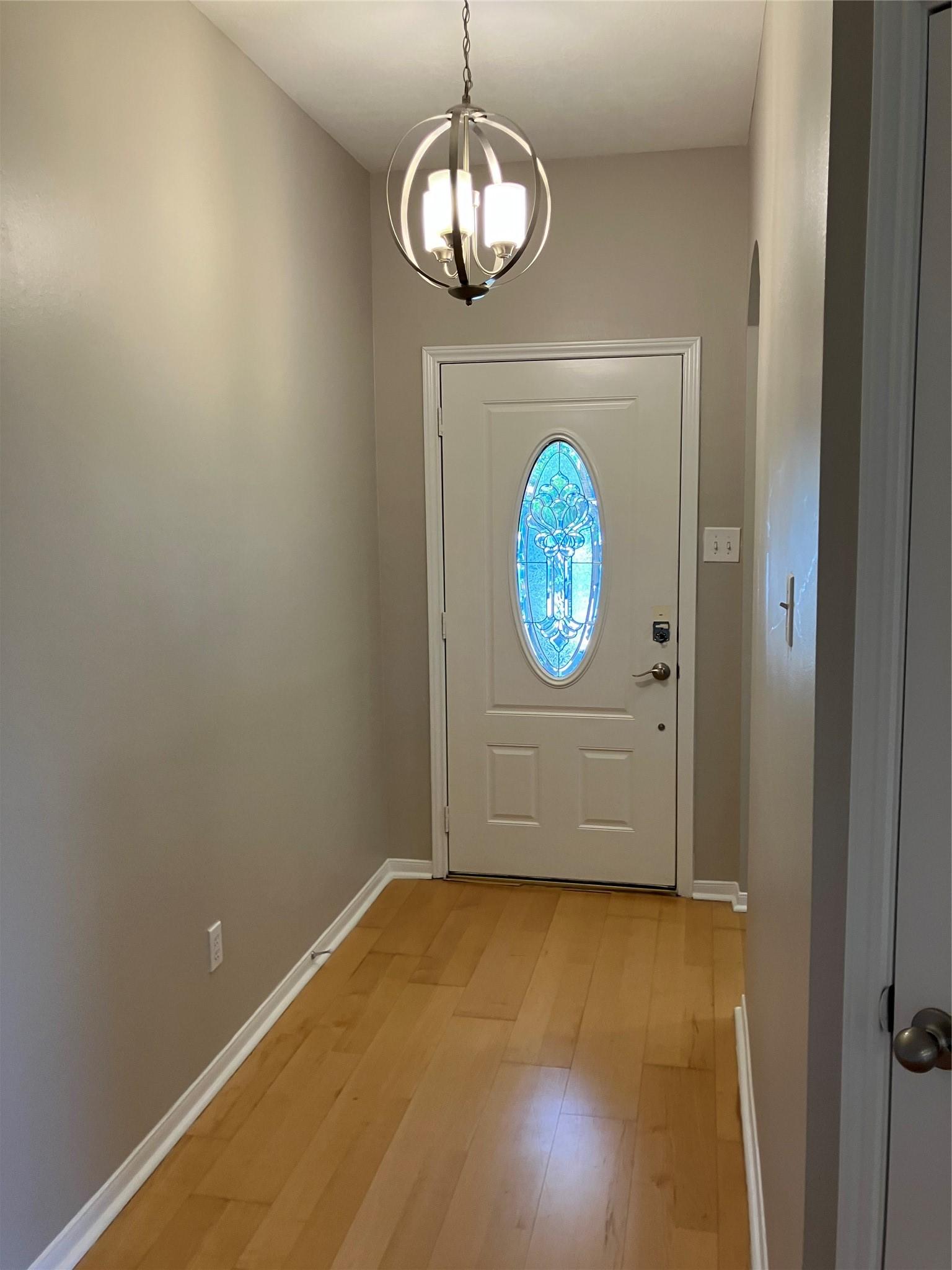 Image 2: This photo shows a welcoming entryway with light w