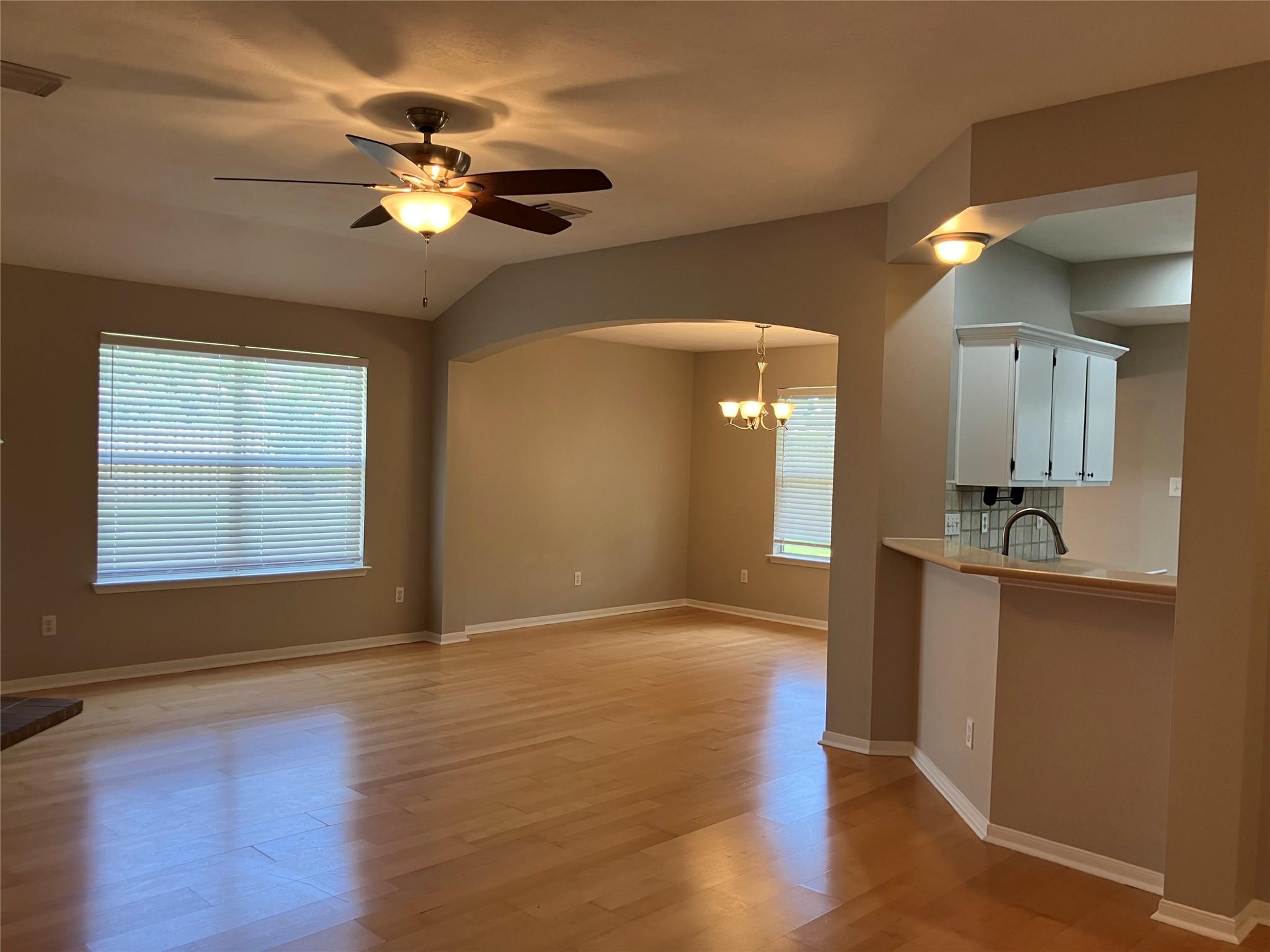 Image 3: This photo showcases an open living area with ligh