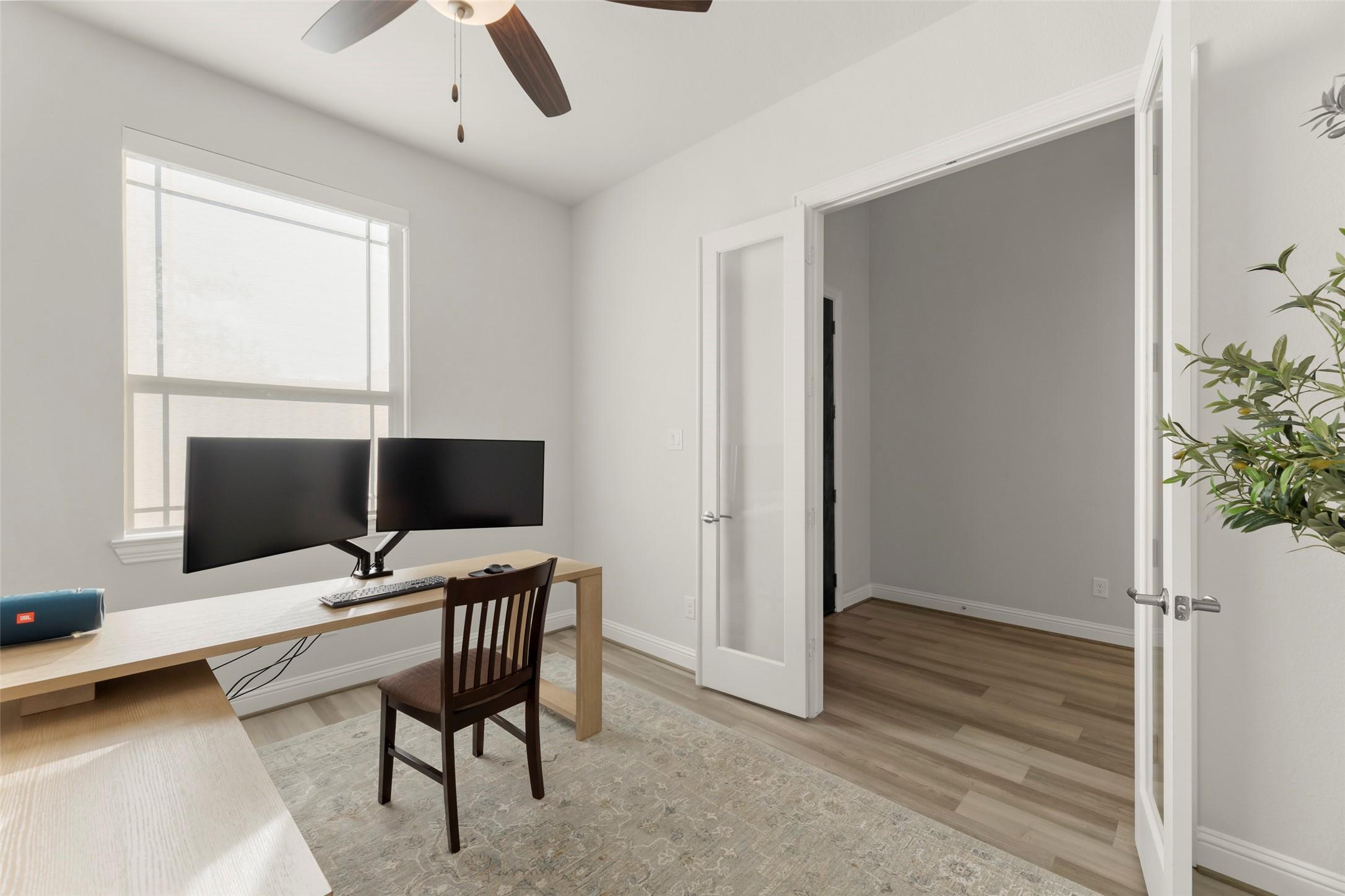 Image 4: The study with French door entry has a large windo