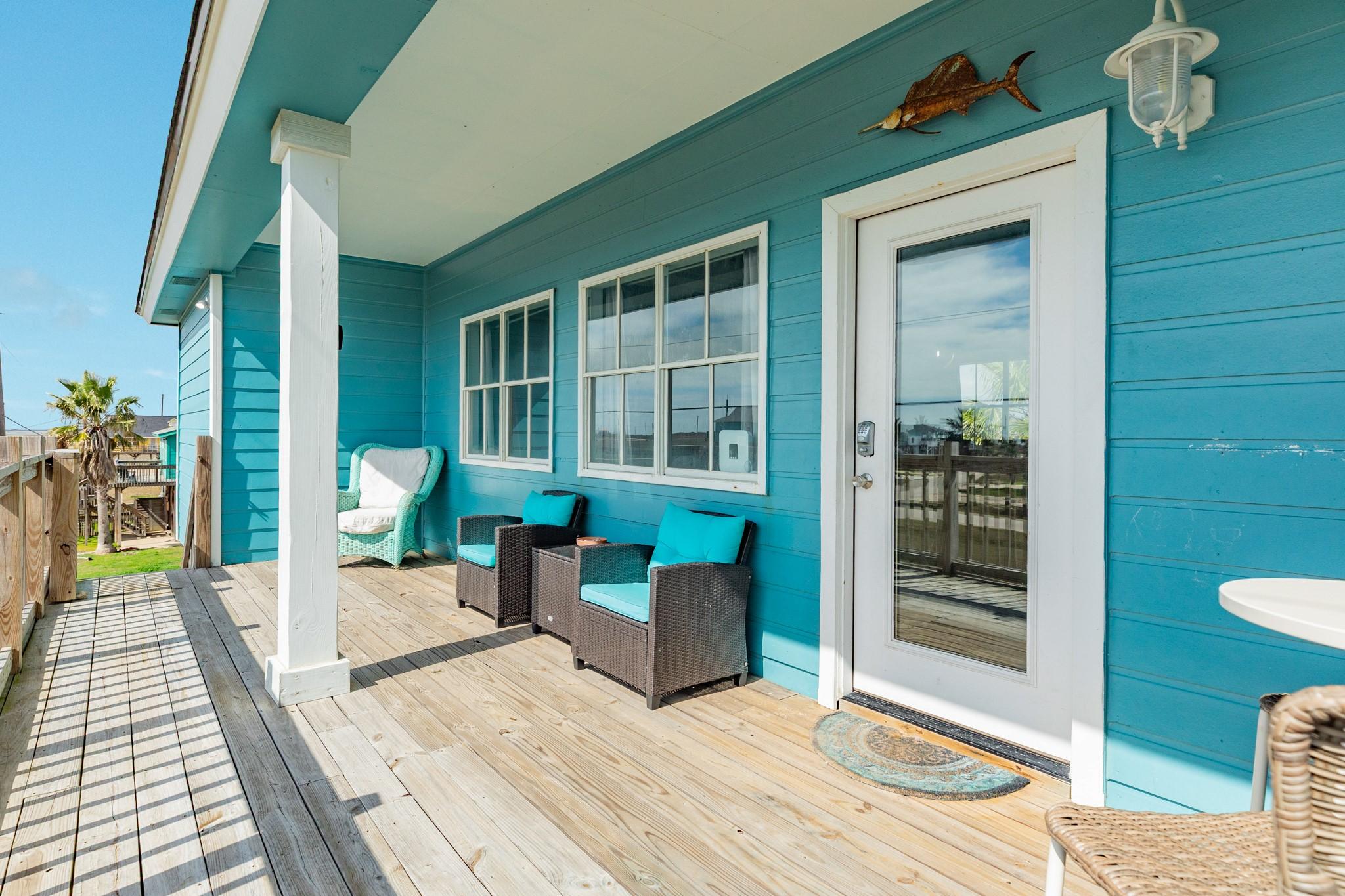 Image 4: Inviting covered porch features wood decking, ceil