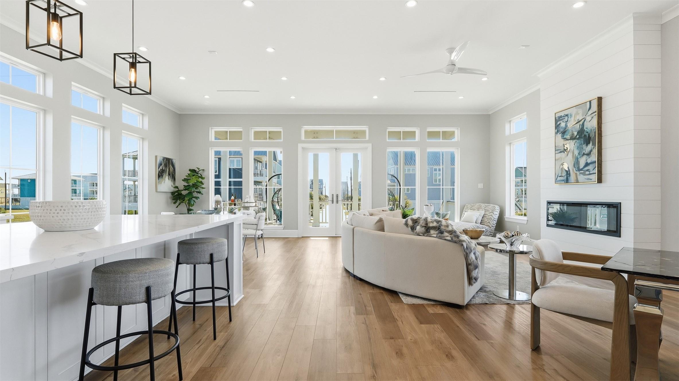 Image 2: This photo showcases a bright, open-concept living