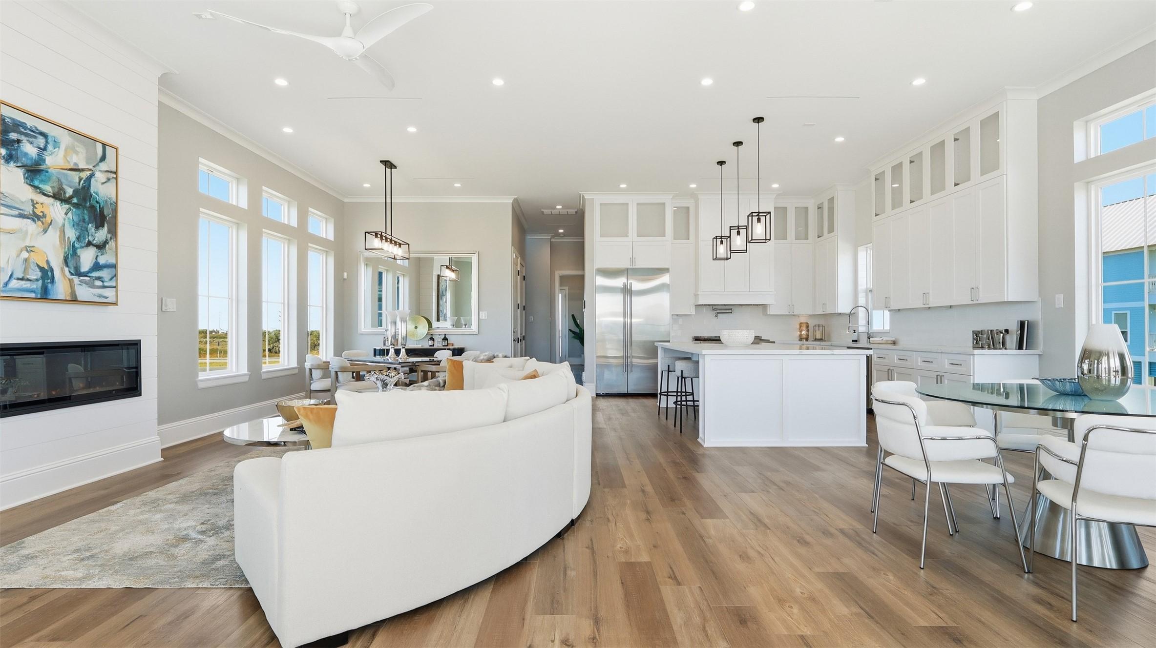 Image 4: This photo showcases a spacious, open-concept livi