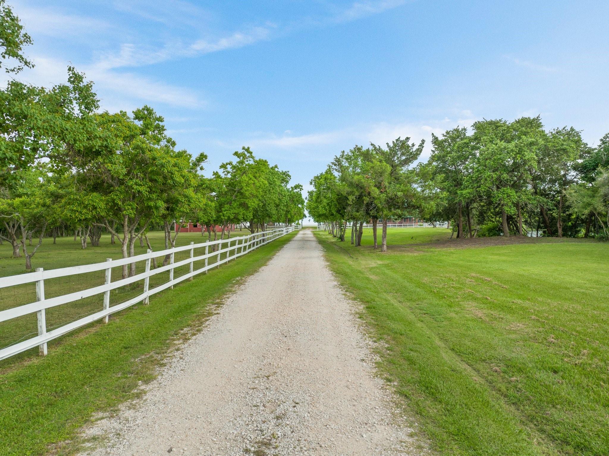 Image 2: The main home is set back over 900 feet from the r
