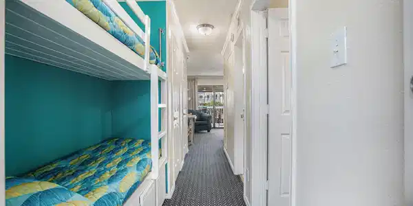 Image 2: Upon entry you&rsquo;ll find a set of bunk beds for extr