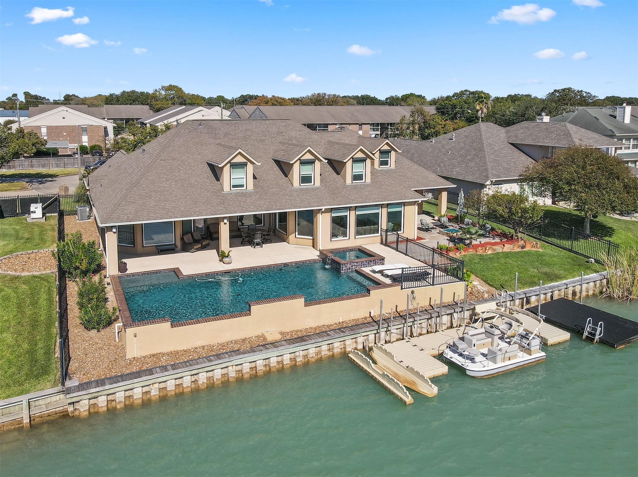 Image 2: Beautiful view of the pool and docks.