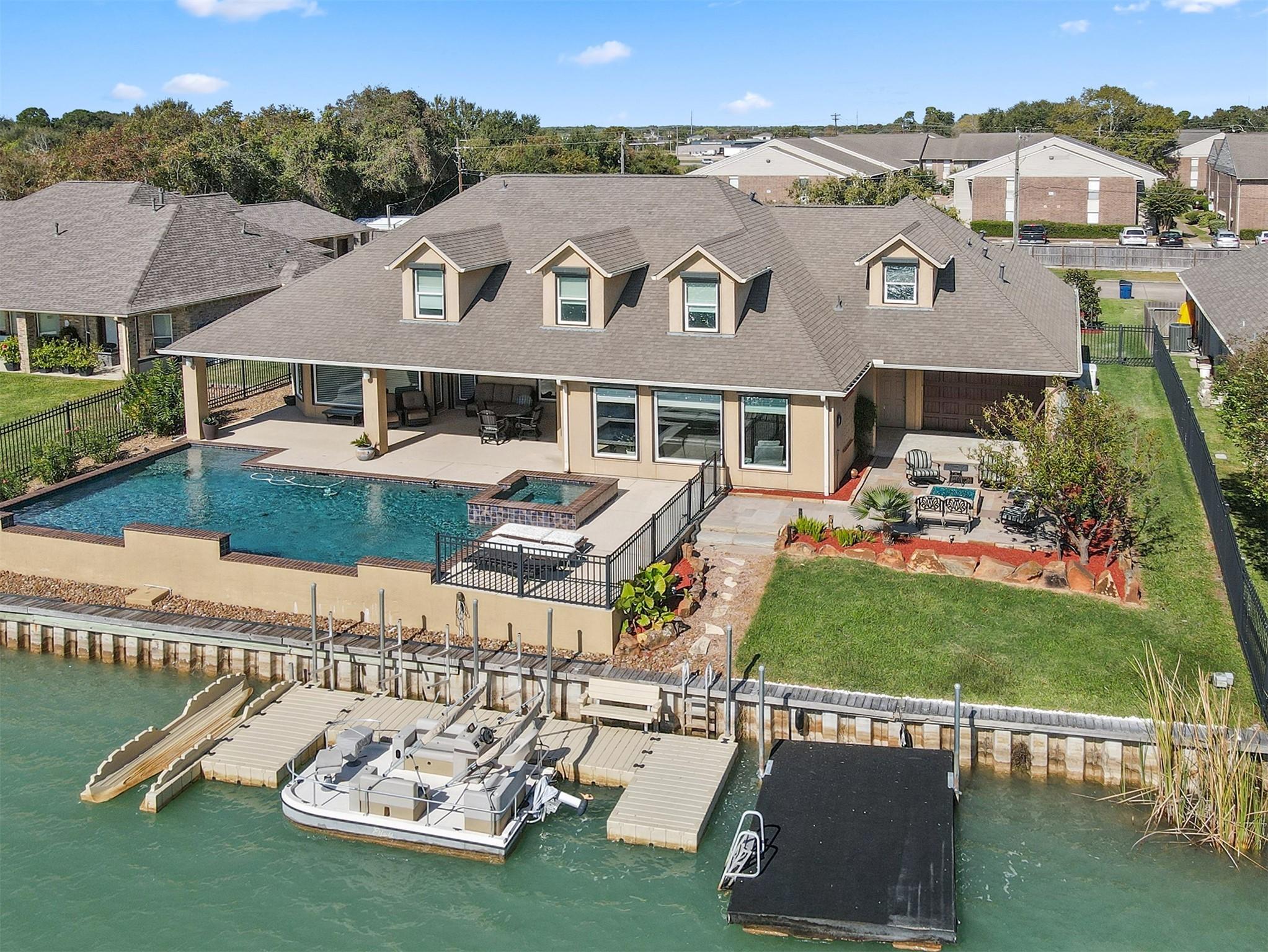 Image 3: Another view of the pool and decks.