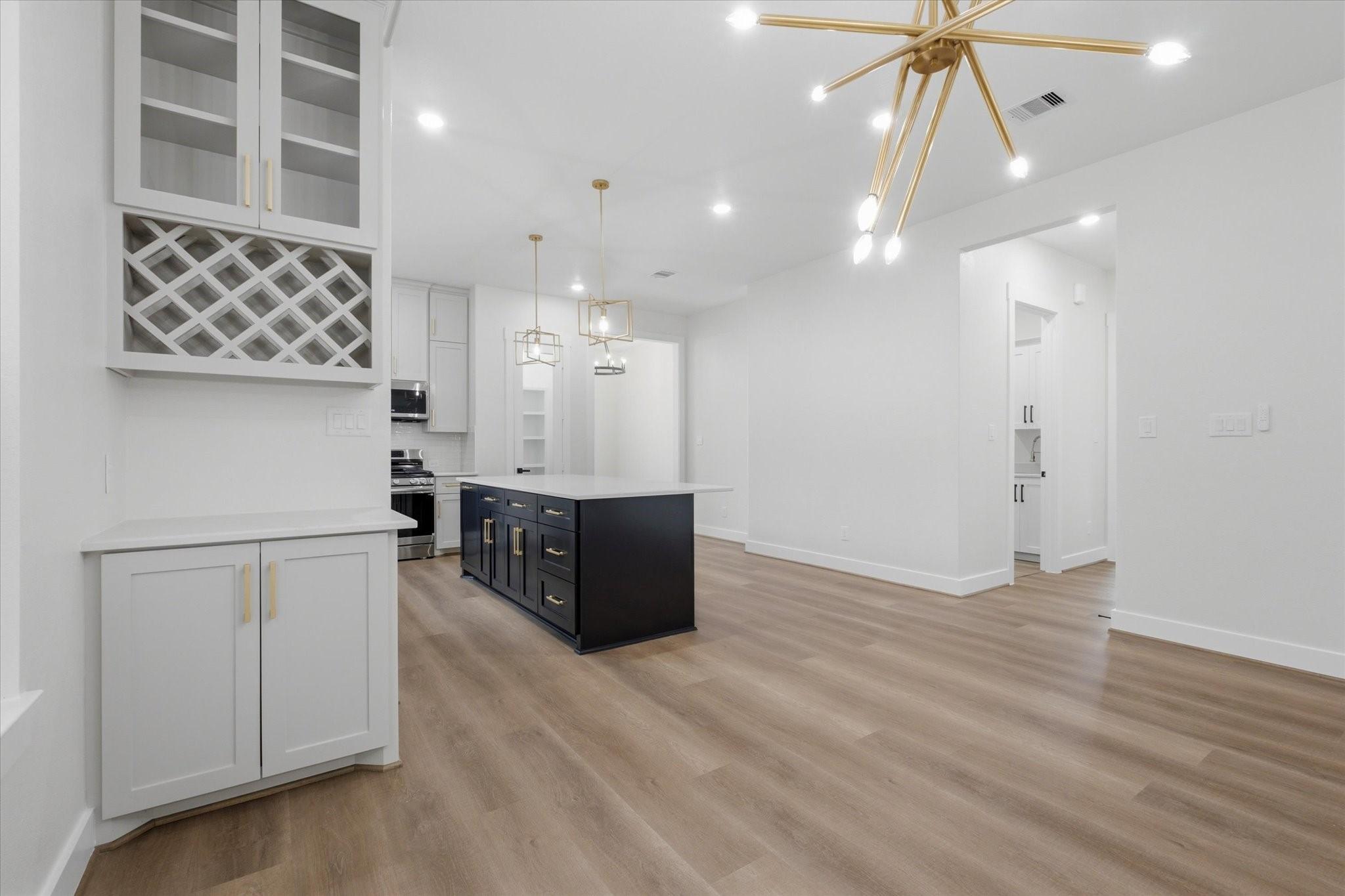 Image 4: Stunning dining area featuring a built-in beverage