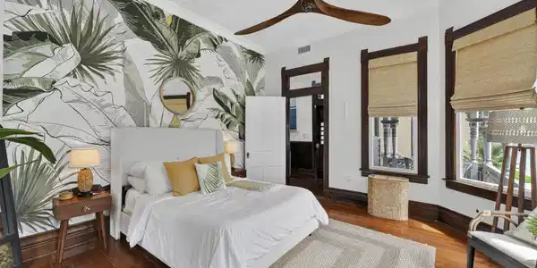Image 3: Charming main-level bedroom filled with warmth, ch