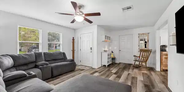 Image 4: Enter into the front living room.  The windows hav