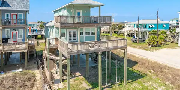 Image 2: Spacious wraparound decks on both levels provide g