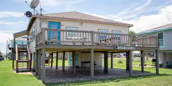 Image 2: Elevated Crystal Beach cottage featuring a spaciou