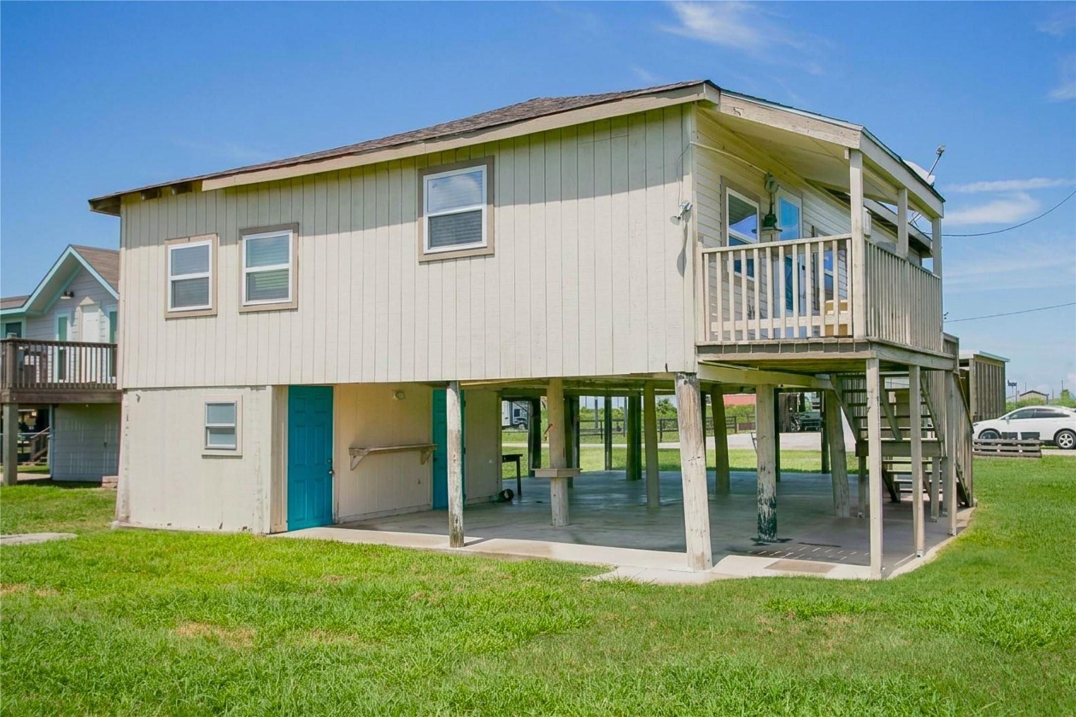 Image 3: View from the back of the home. The first turquois